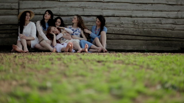 Girl near a wooden house