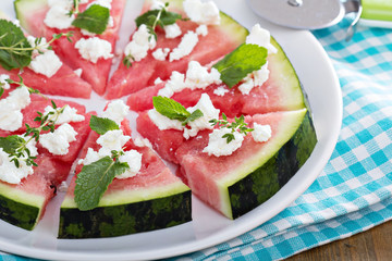 Watermelon pizza with feta cheese and herbs