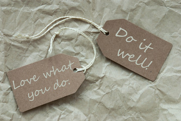 Two Beige Labels With Quote Love Do Well Paper Background