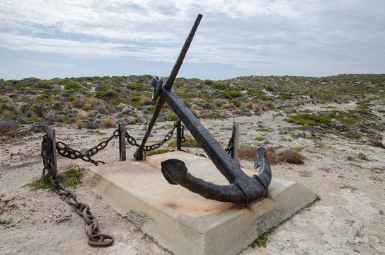 ship wreck ancor on a pedestal in coastal dunes