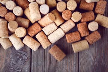 Wine corks on rustic wooden planks background