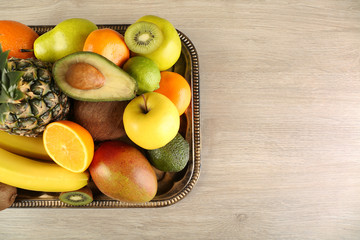 Assortment of fruits on wooden table