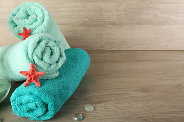 Beautiful towels with sea stars and decorative stones