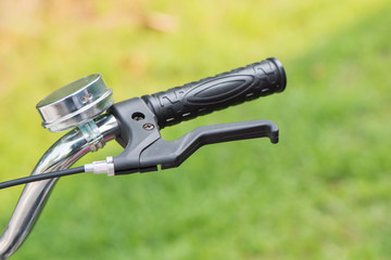 Close up handlebars bicycle bell on nature background