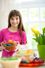 girl holding colorful eggs