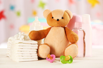 Baby accessories on table on light background