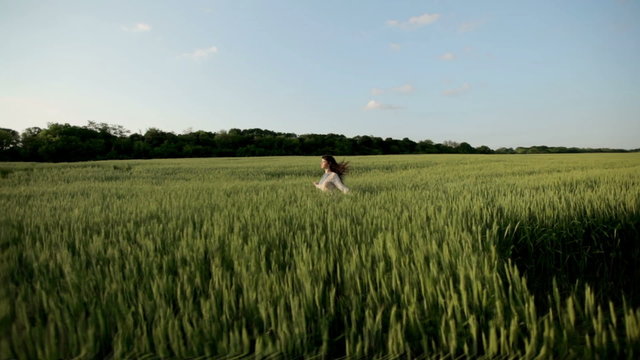 Girl runs across the field