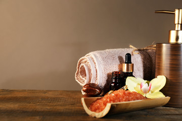 Spa still life on wooden table on brown background