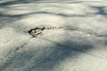 Obraz premium Very bad quality road with potholes