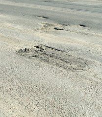 Fototapeta na wymiar Very bad quality road with potholes