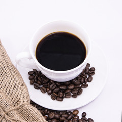 Coffee cup and beans on a white background.