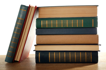 Old books on wooden table, closeup