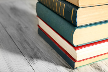 Old books on wooden table background