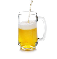 Beer pouring into glass isolated on white