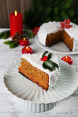 Slice of cake covered cream with Christmas decoration
