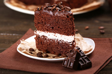 Delicious chocolate cake on table close-up