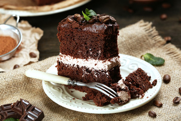 Delicious chocolate cake on table close-up