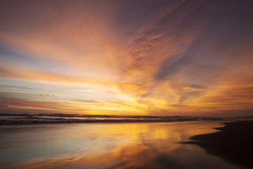 Fototapeta na wymiar Golden scenery of sunset at beach