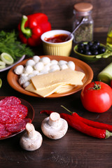 Different products on wooden table close up