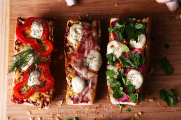 Different sandwiches with vegetables and cheese