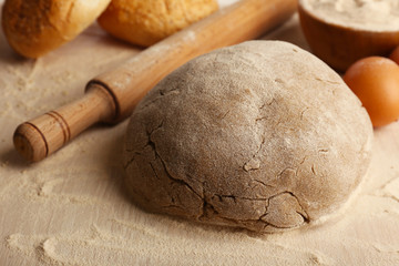 Making bread on wooden table background