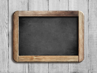 old chalkboard or blackboard on white wood - obrazy, fototapety, plakaty
