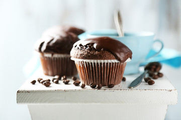 Tasty homemade chocolate muffins and cup of coffee