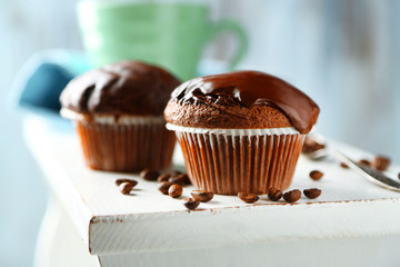 Tasty homemade chocolate muffins and cup of coffee