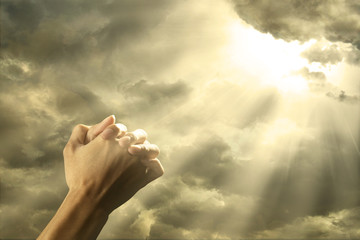 Prayer raised hands on the sky