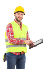 Smiling construction worker using a shockproof digital tablet