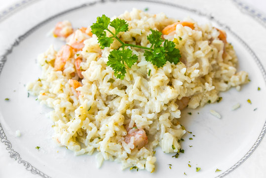 seafood risotto topped with parsley