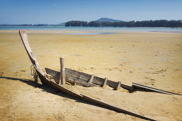 Destroyed boat in area of sea tide