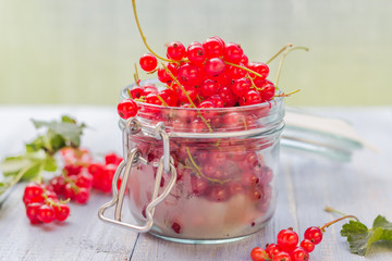 red currant fruit jar wooden table