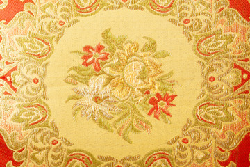 Fragment of colorful retro tapestry textile pattern with floral