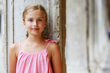 Beautiful young girl in summer dress in Venice, Italy