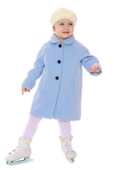 charming little skater skating in a beautiful blue coat