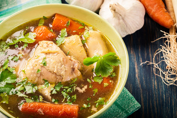 Chicken broth with noodles and carrot