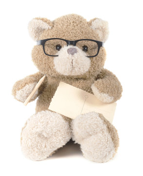 teddybear with glasses holding pen and paper