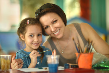 Little girl painting