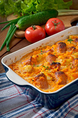 Casserole with sausage, bacon and apples in a pumpkin sauce