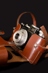 Fototapeta na wymiar Vintage camera on a dark background