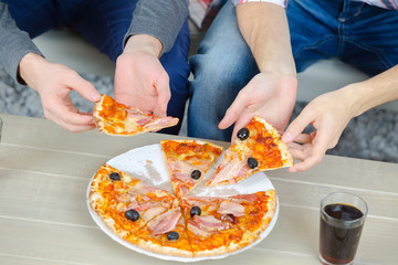 Friends sharing a pizza