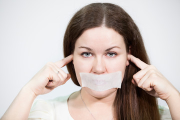 Woman with glued tape on mouth and closed ears, grey background