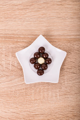 Chocolate star on a wooden background