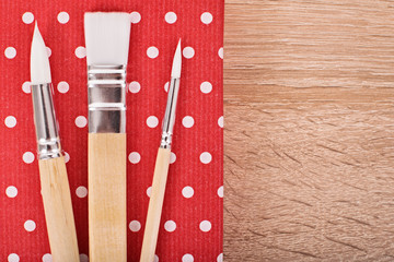 Paint brush on a wooden background