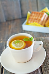 tea with lemon and waffle