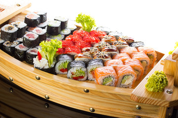 Sushi set in the wooden ship.