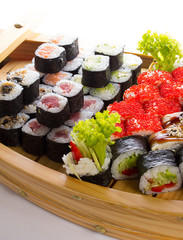 Sushi set in the wooden ship.