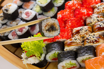 Sushi set in the wooden ship.