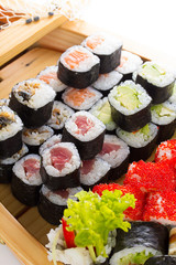 Sushi set in the wooden ship.